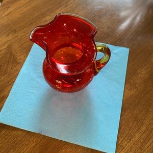 A Red and Yellow Handle Small Pitcher